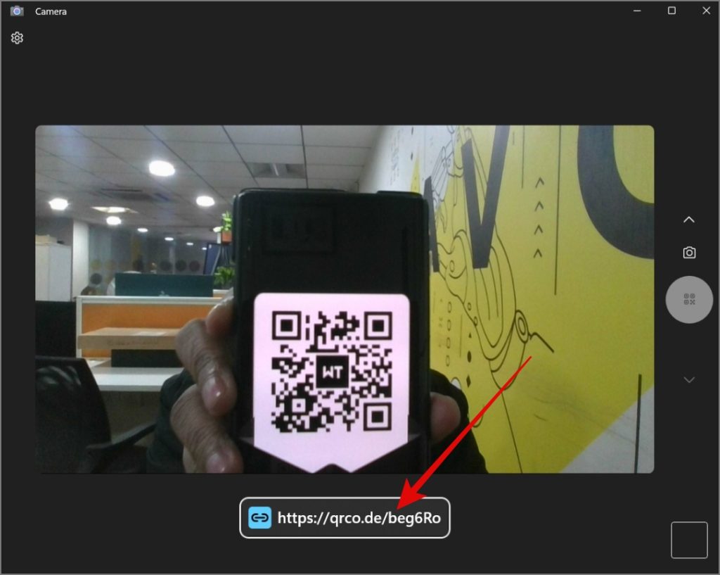Place the QR code in front of the webcam